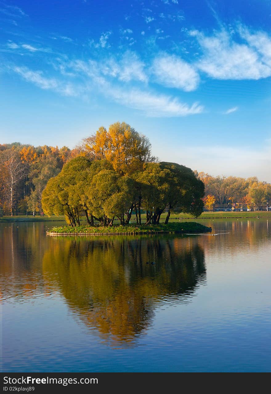 Idyllic  park area near blue lake in spring