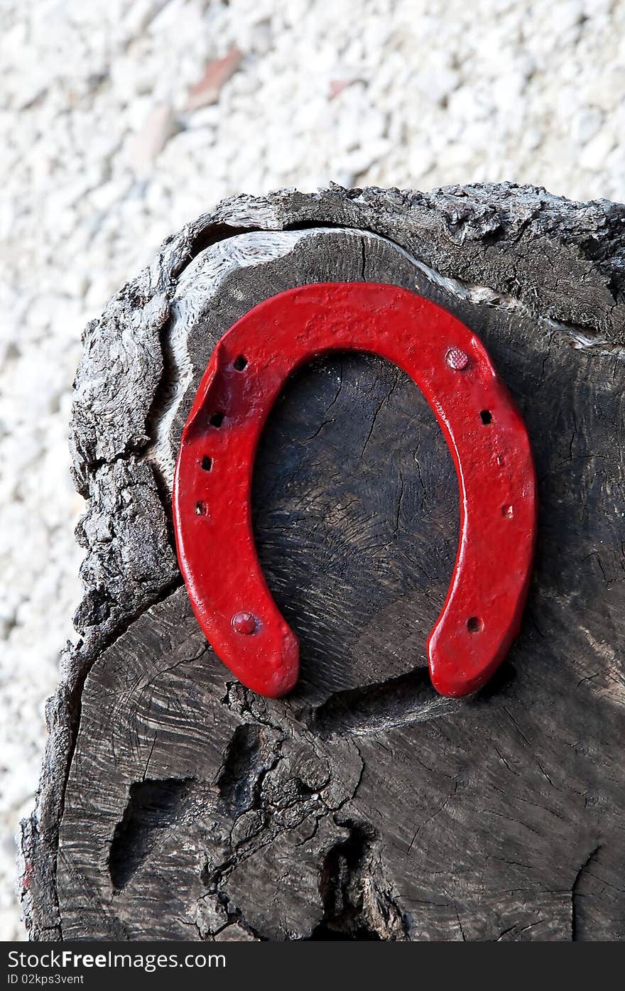 Red horseshoe on the wood