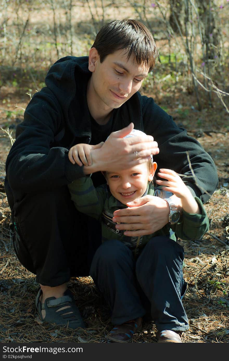 The father and the son have fun in park