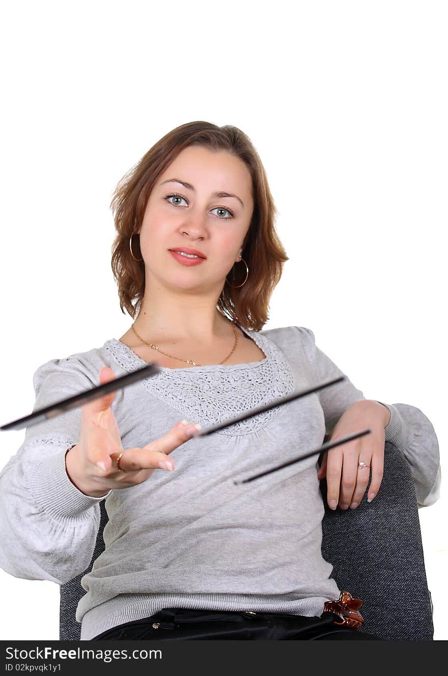 Girl sitting on a chair throwing old black floppy. Girl sitting on a chair throwing old black floppy