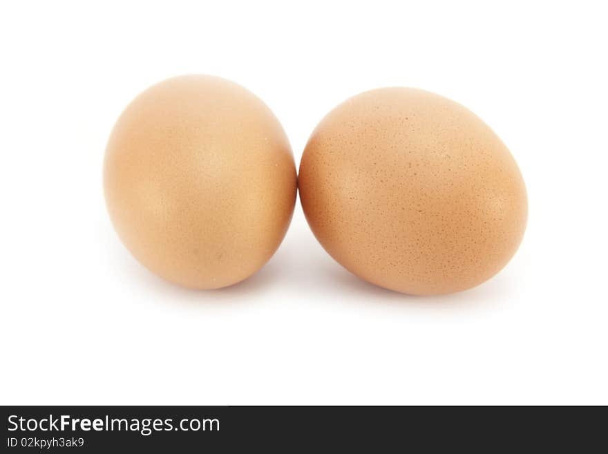 Two Organic Wholegrain Borwn Eggs isolated on a white background. Two Organic Wholegrain Borwn Eggs isolated on a white background