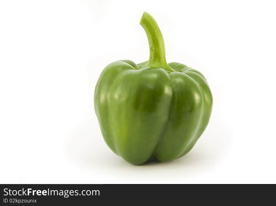 A whole fresh bright Green Pepper isolated on a white background