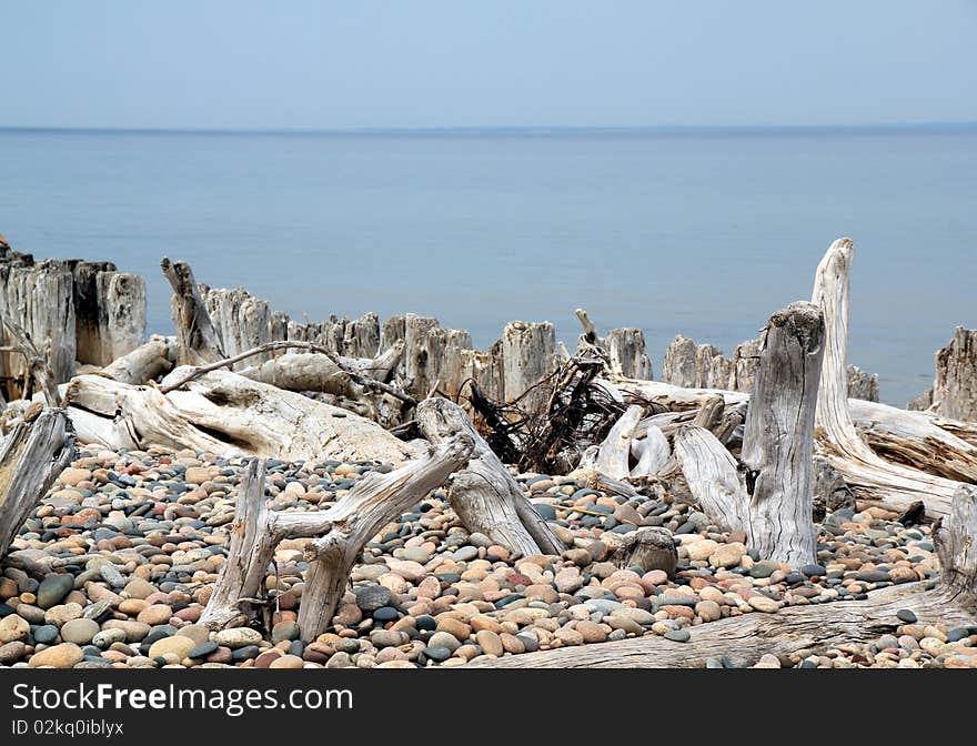 Lake Superior Whitefish Point, MI shoreline of rocks and driftwood. Lake Superior Whitefish Point, MI shoreline of rocks and driftwood.