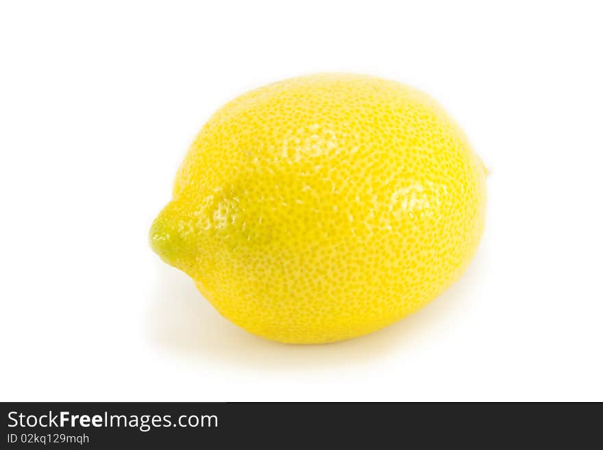 Whole fresh ripe organic yellow lemon isolated on a white background. Whole fresh ripe organic yellow lemon isolated on a white background