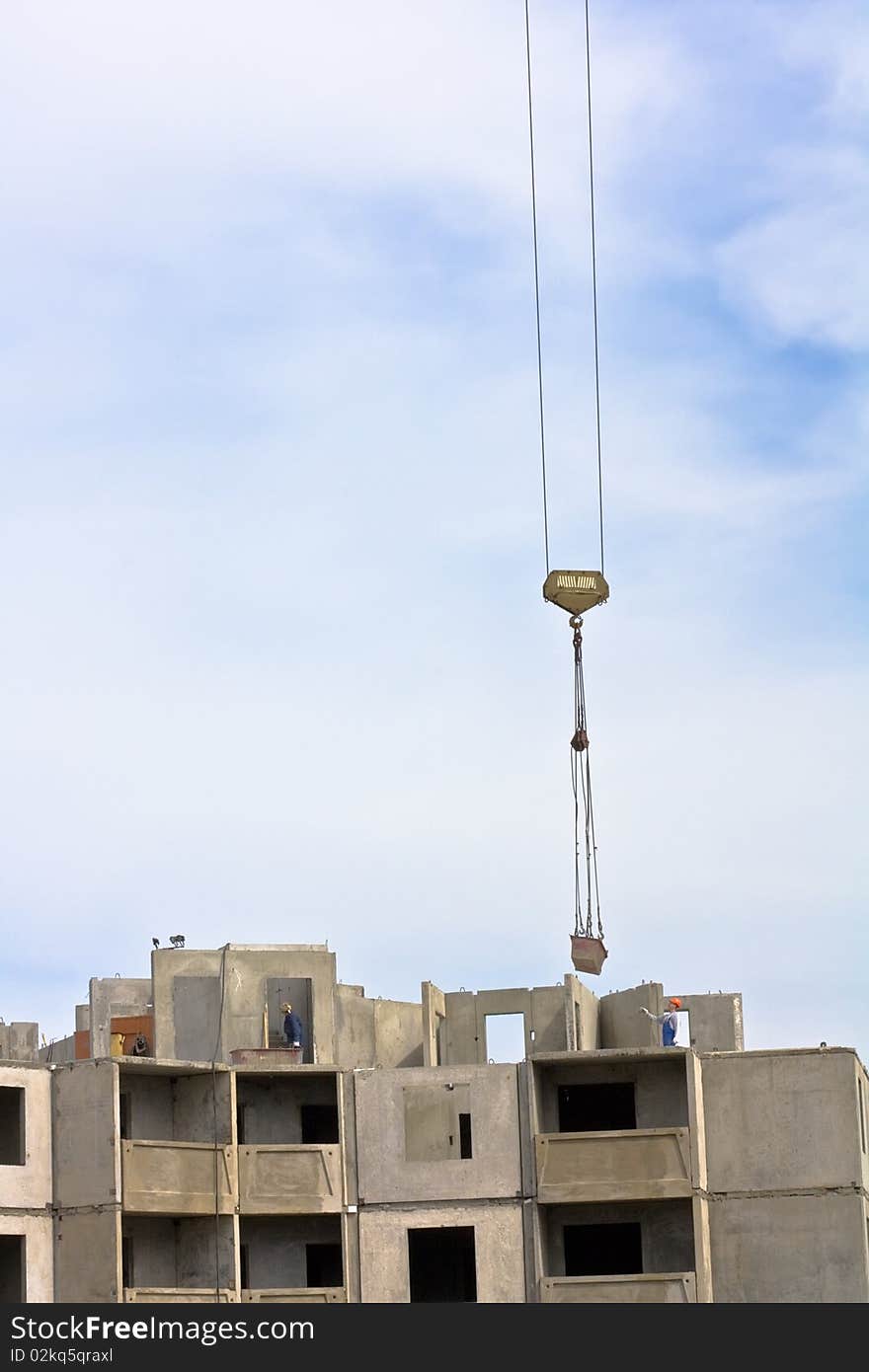 Crane over blue sky with building. Crane over blue sky with building