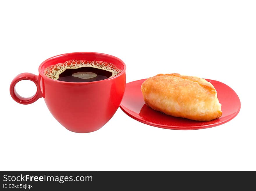 Cup of coffee and patty are photographed on the white background