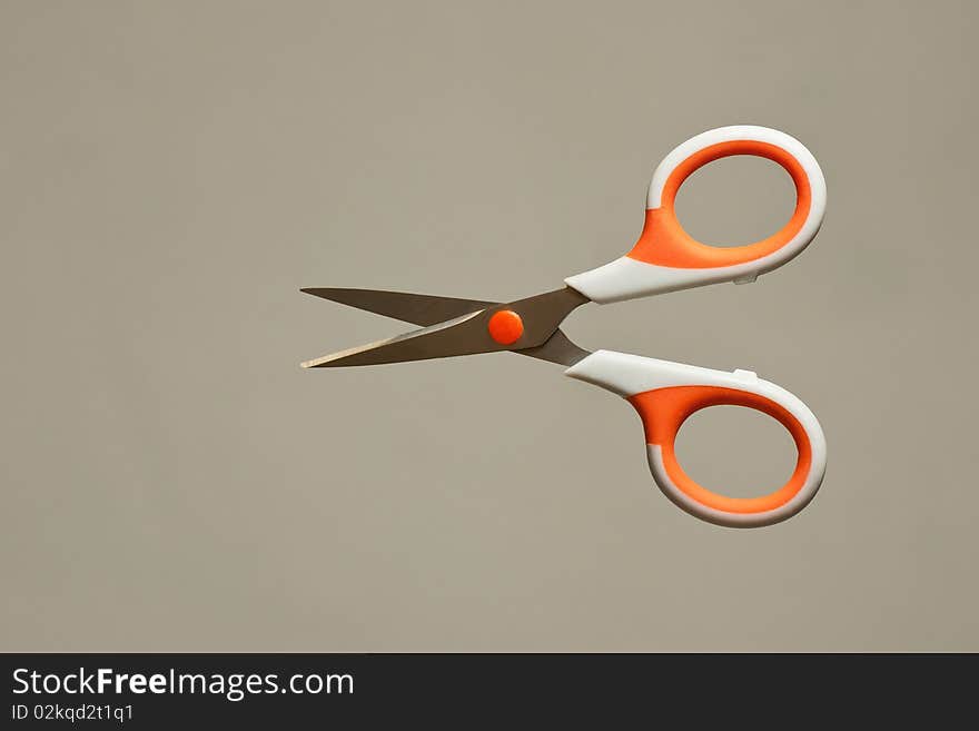 Isolated scissors on grey background