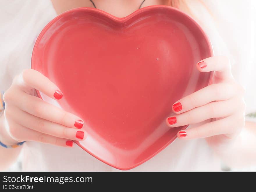 Teenager holding heart