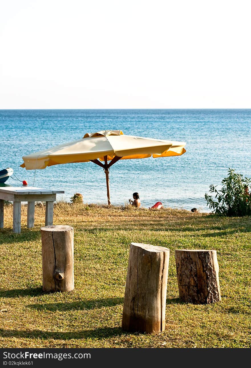 Stools and umbrella on the beach