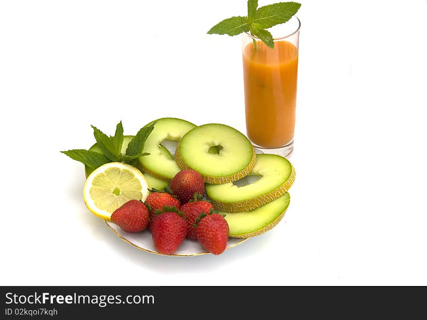 The strawberry, melon  and juise isolated on a white background. The strawberry, melon  and juise isolated on a white background