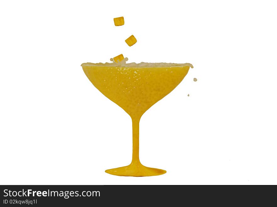 Styled lemon glass with lemons ice cubes and drops of juice