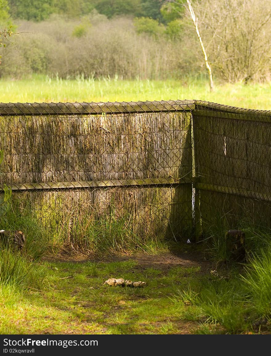 A birdwatching hideout, looking on a lake