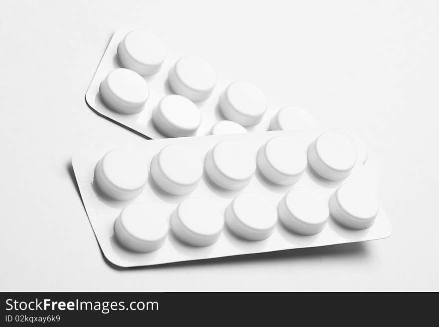 Macro of pills isolated on white background