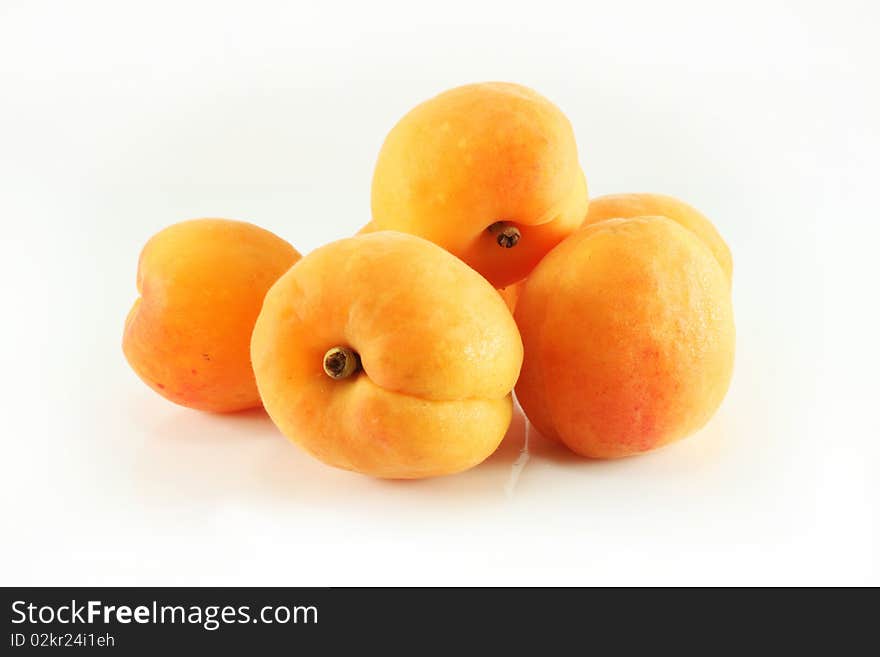 Apricots on a white background