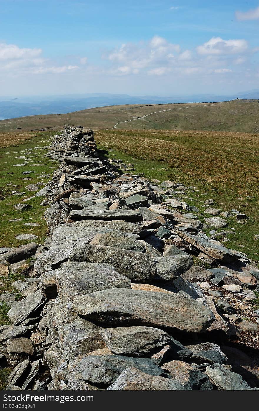 A stone wall forming an ancient road