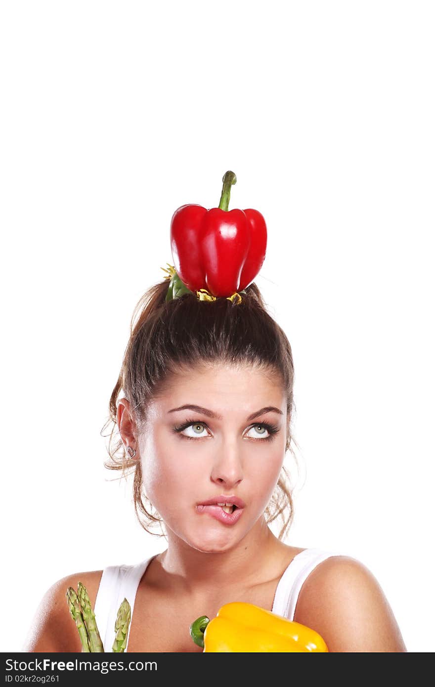 Young beautiful woman with fresh vegetables in her hands. Young beautiful woman with fresh vegetables in her hands