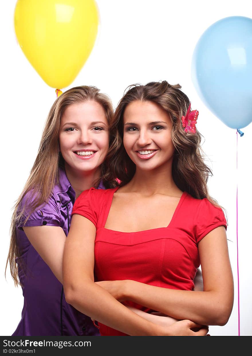 Two beautiful young girlfriends with color balloons. Two beautiful young girlfriends with color balloons