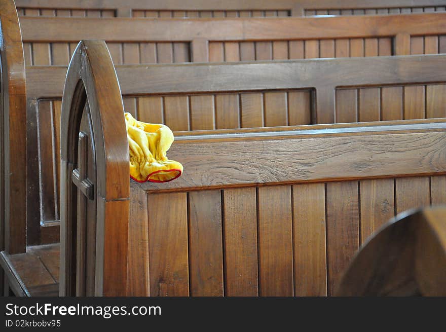 Empty Chairs and donation pouch in Church