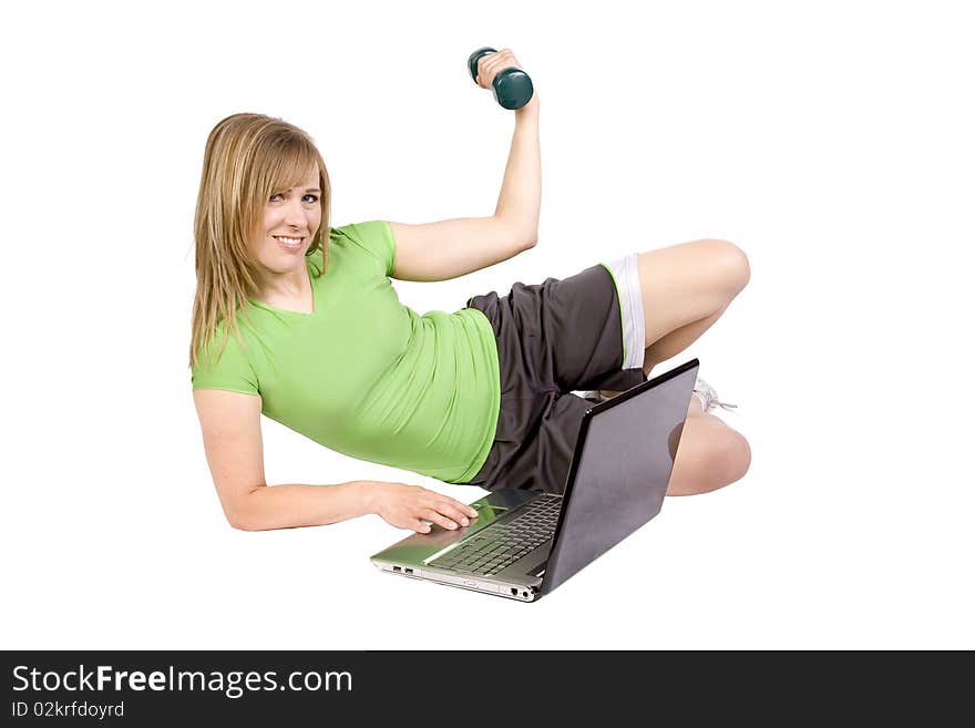 A woman with a laptop computer and wearing an exercise outfit. A woman with a laptop computer and wearing an exercise outfit.