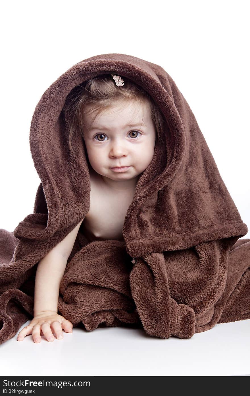 Beautiful Baby Under A Brown Towel