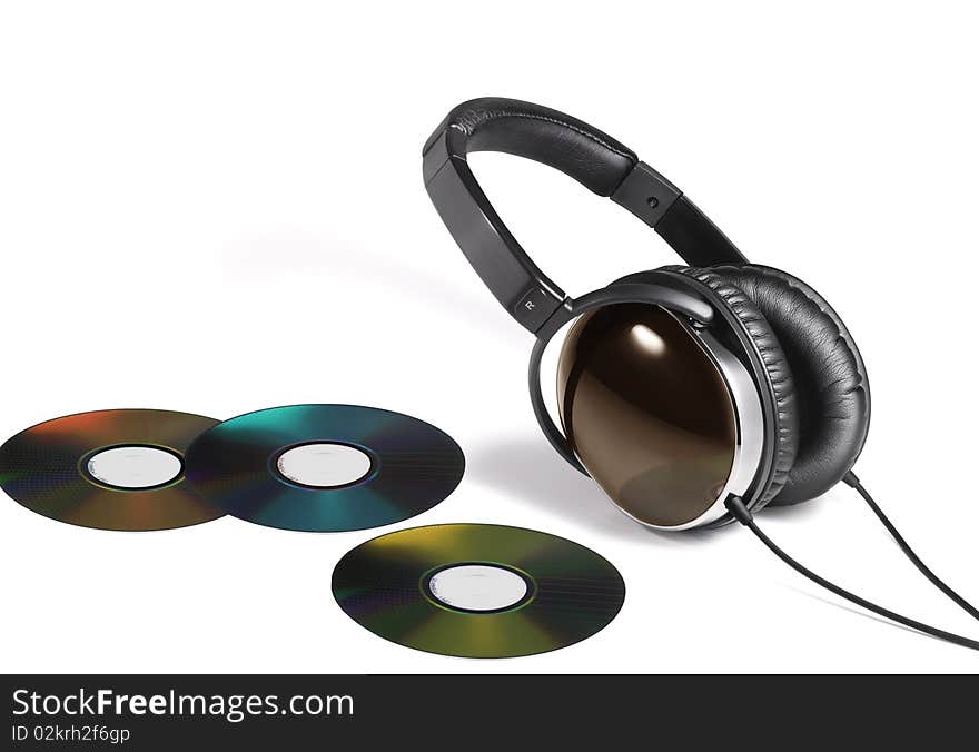 Image of head phones and multi color DVD. Image of head phones and multi color DVD