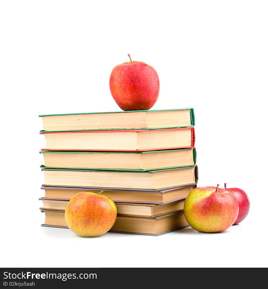 Apples and books isolated on a white background