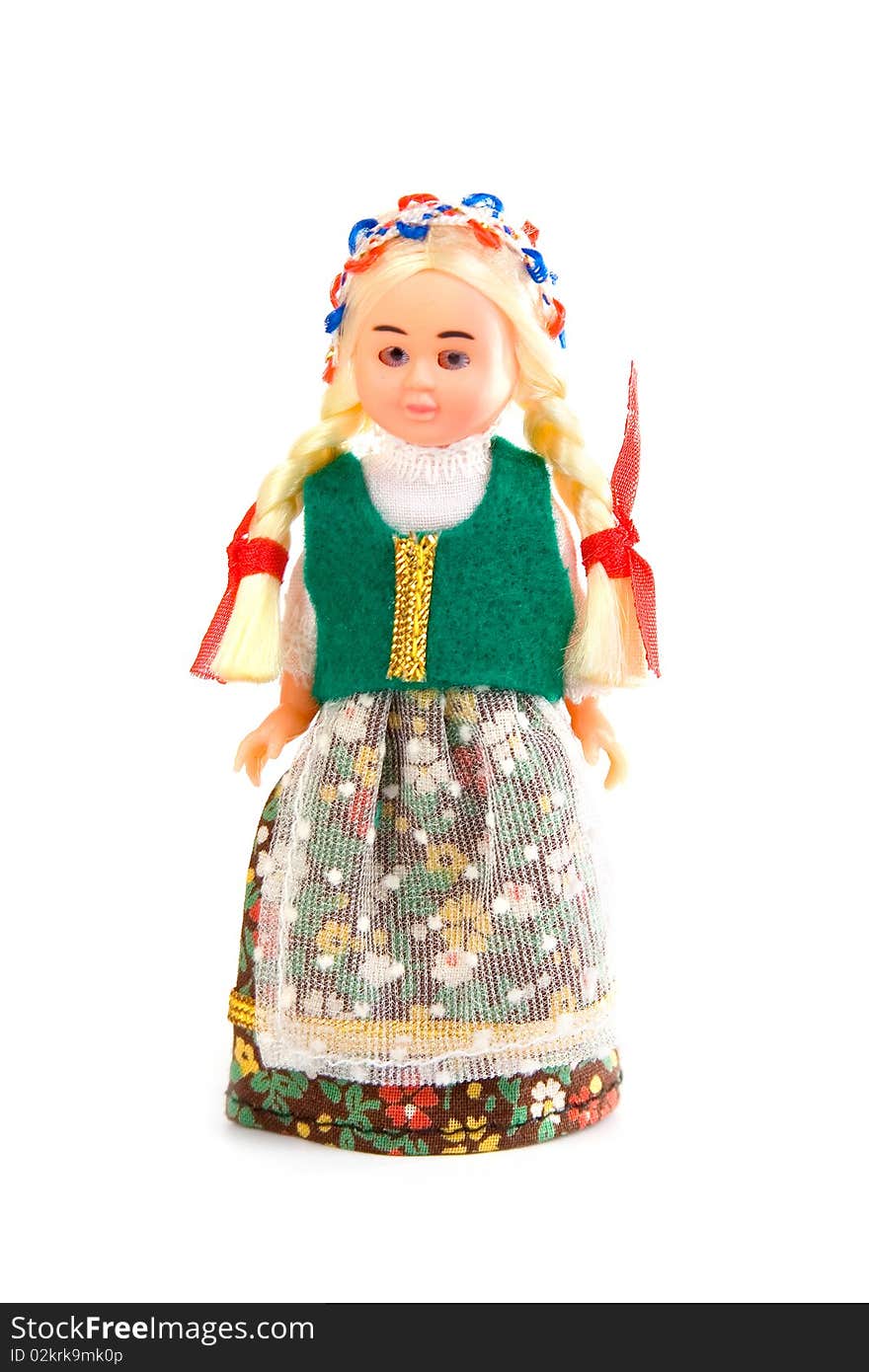 Doll in the Polish national costume on a white background