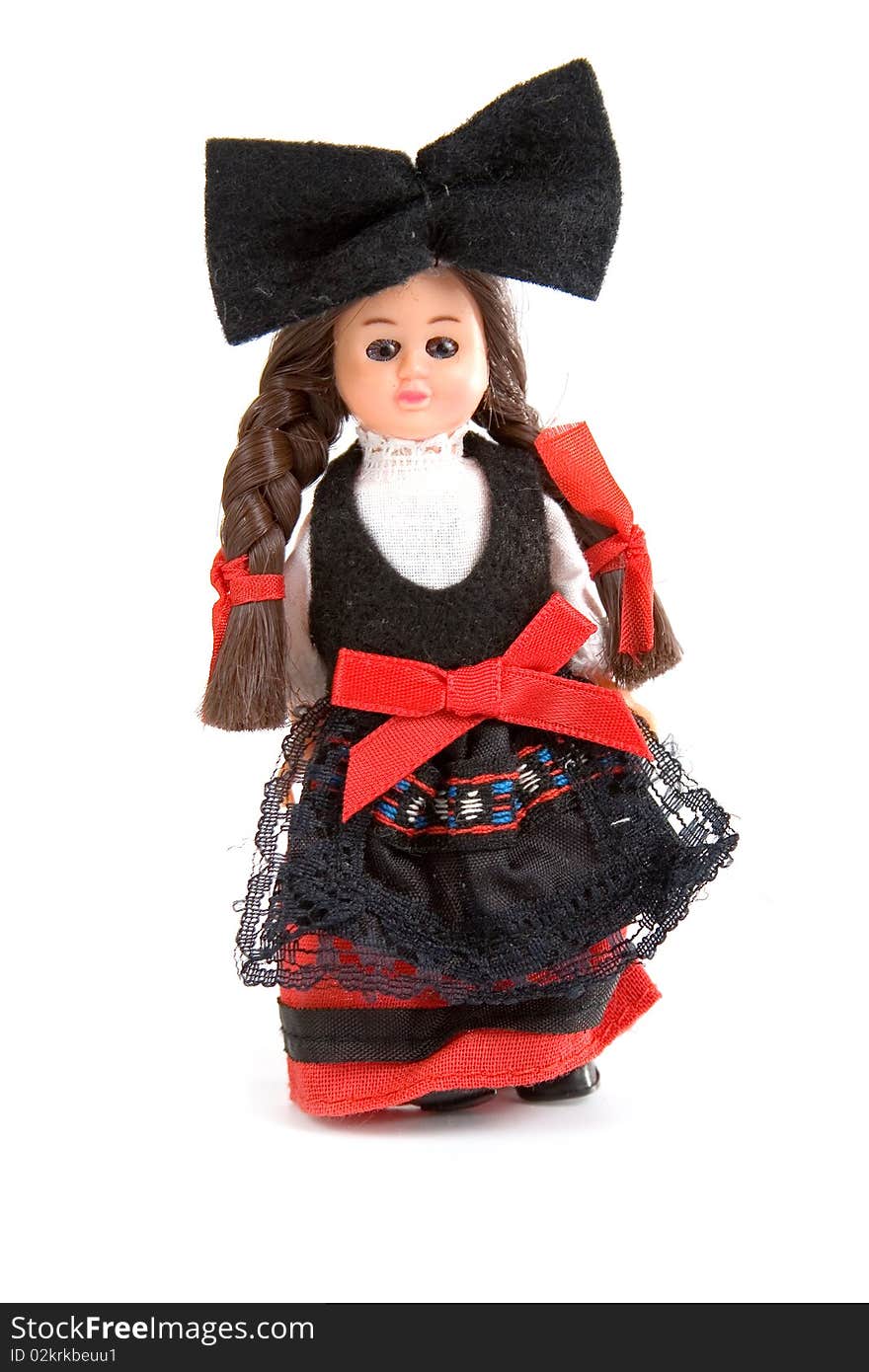 Doll in the French national costume on a white background. Doll in the French national costume on a white background