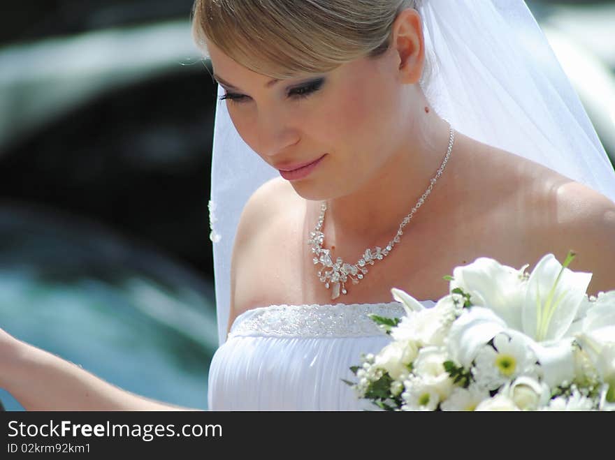 The young woman the bride with a bouquet color