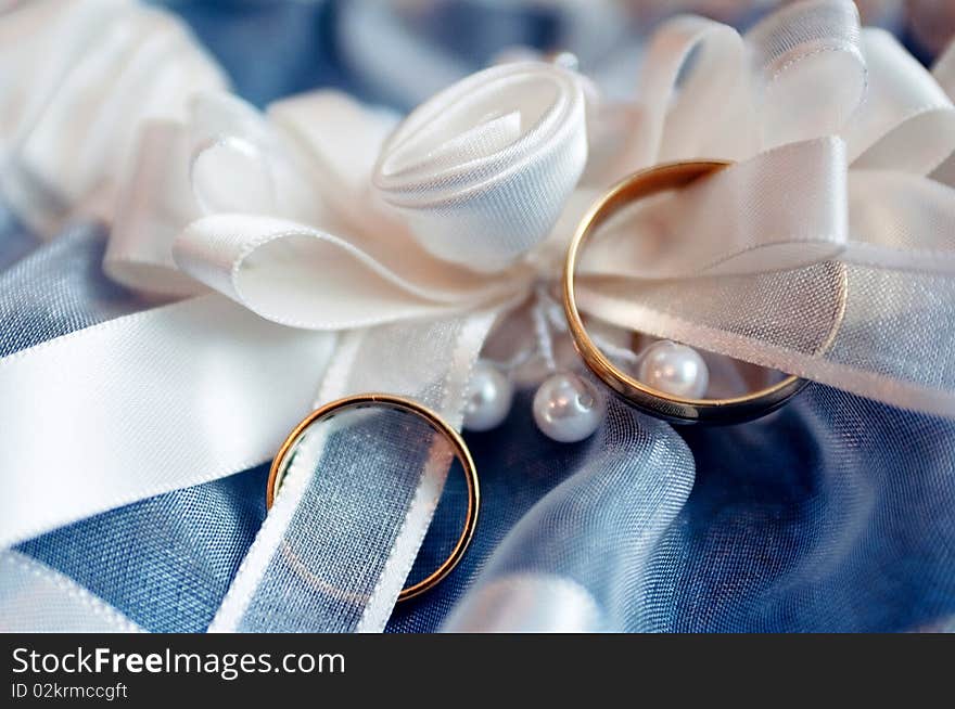 Beautiful background with two gold wedding rings