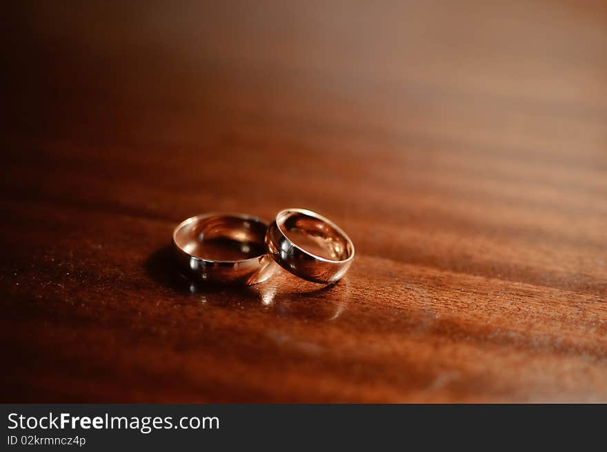 Beautiful background with two gold wedding rings