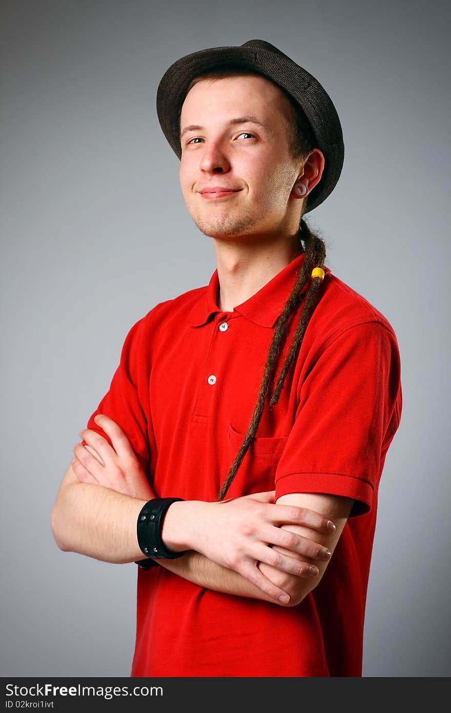 Close-up of a young man in hat