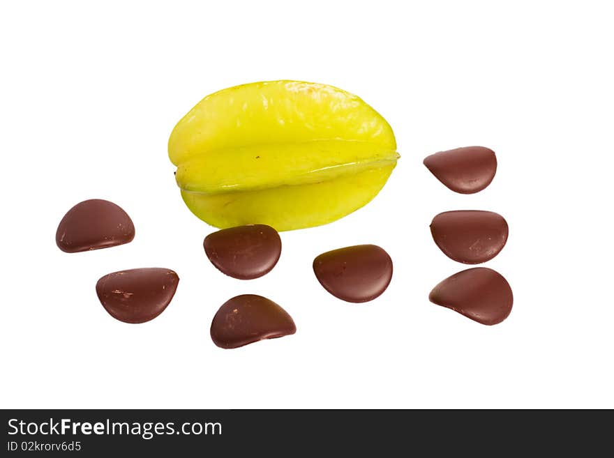 Star fruit with chocolate petals on white background