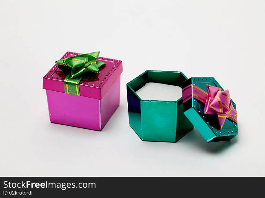 A small pink and open green box for a small gift. A small pink and open green box for a small gift.