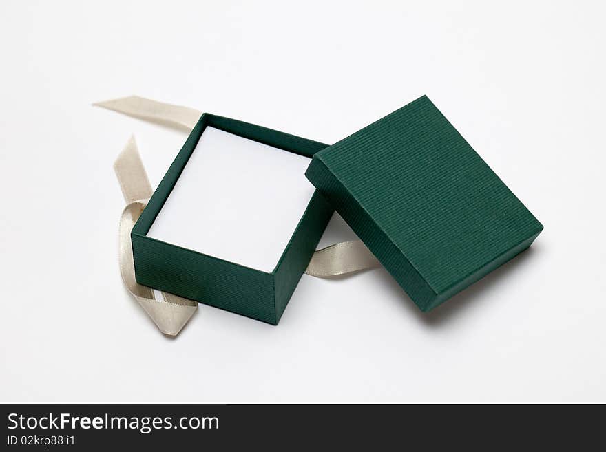 A small green gift box that is open. A small green gift box that is open.