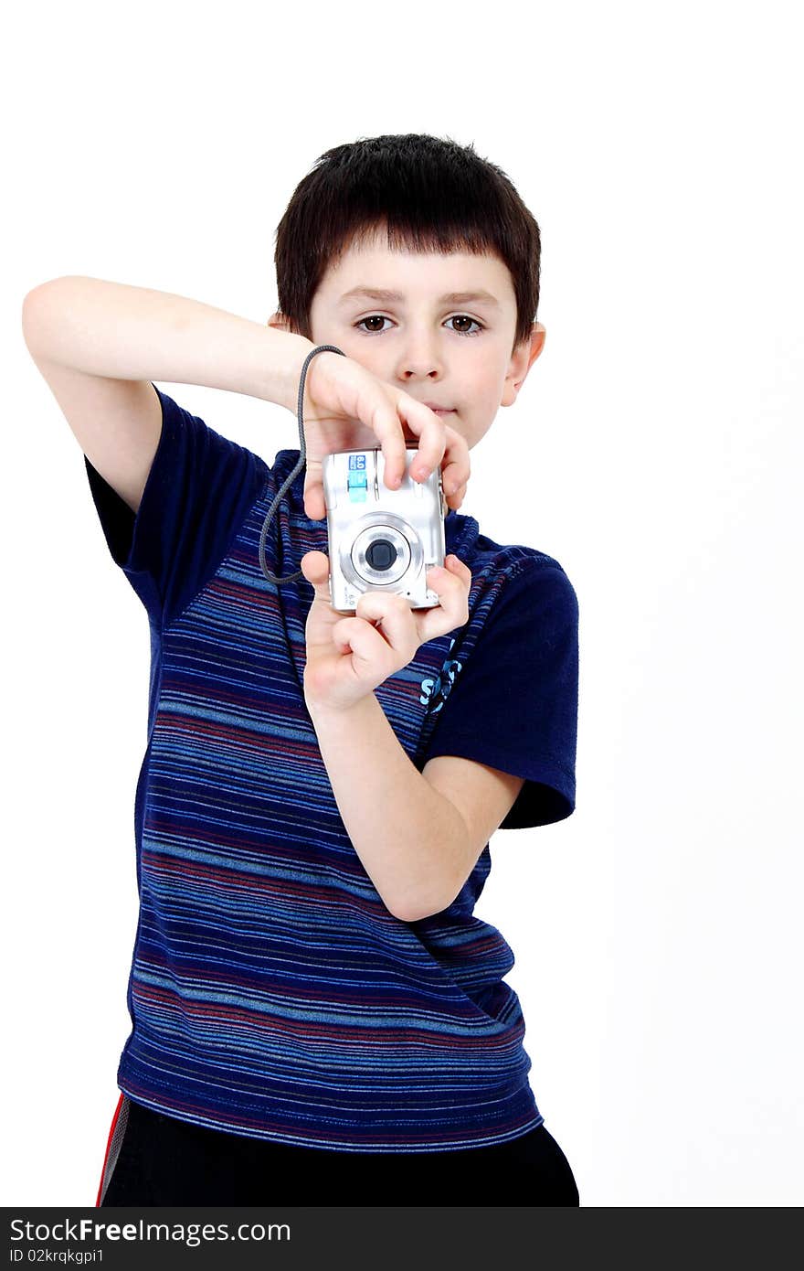 Young boy with digital camera prepare for shooting