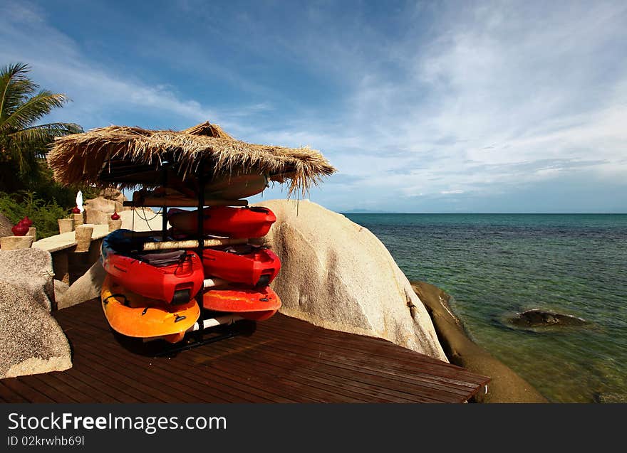 Canoes or Kayak on a deck by the coral reef in Koh Tao, Thailand.