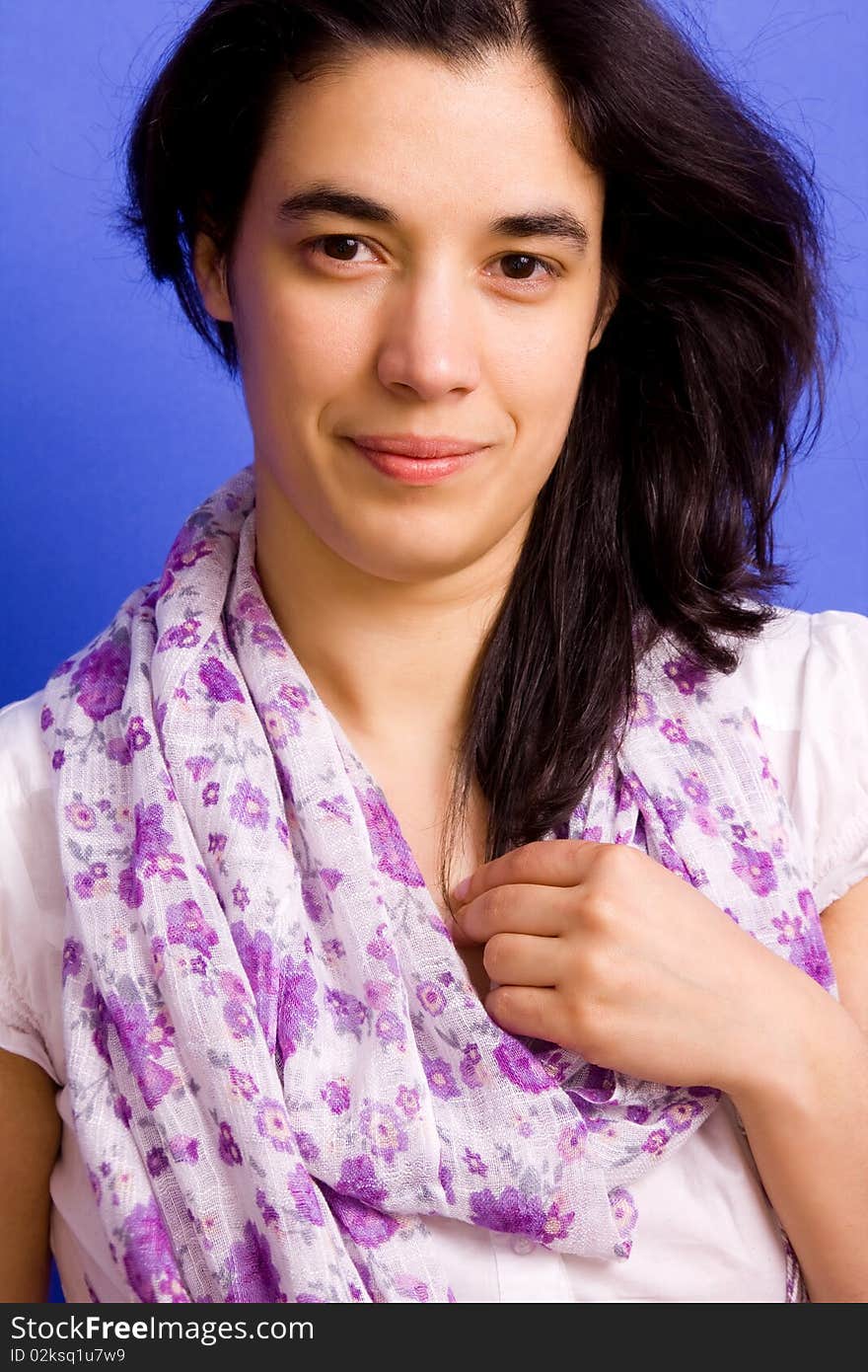 Young beautiful brunette woman, on a blue background. Young beautiful brunette woman, on a blue background