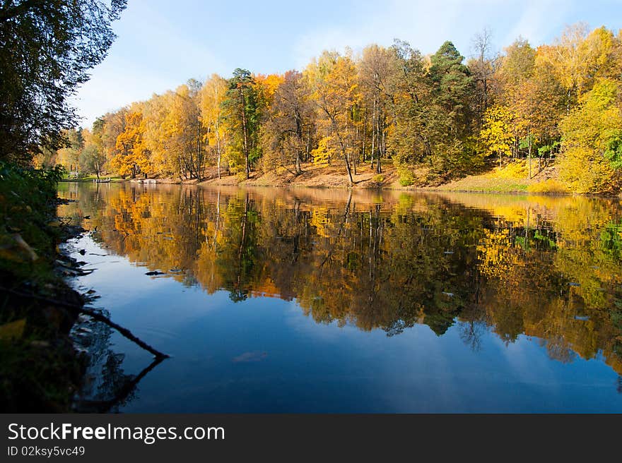 Idyllic  park area near blue lake in spring