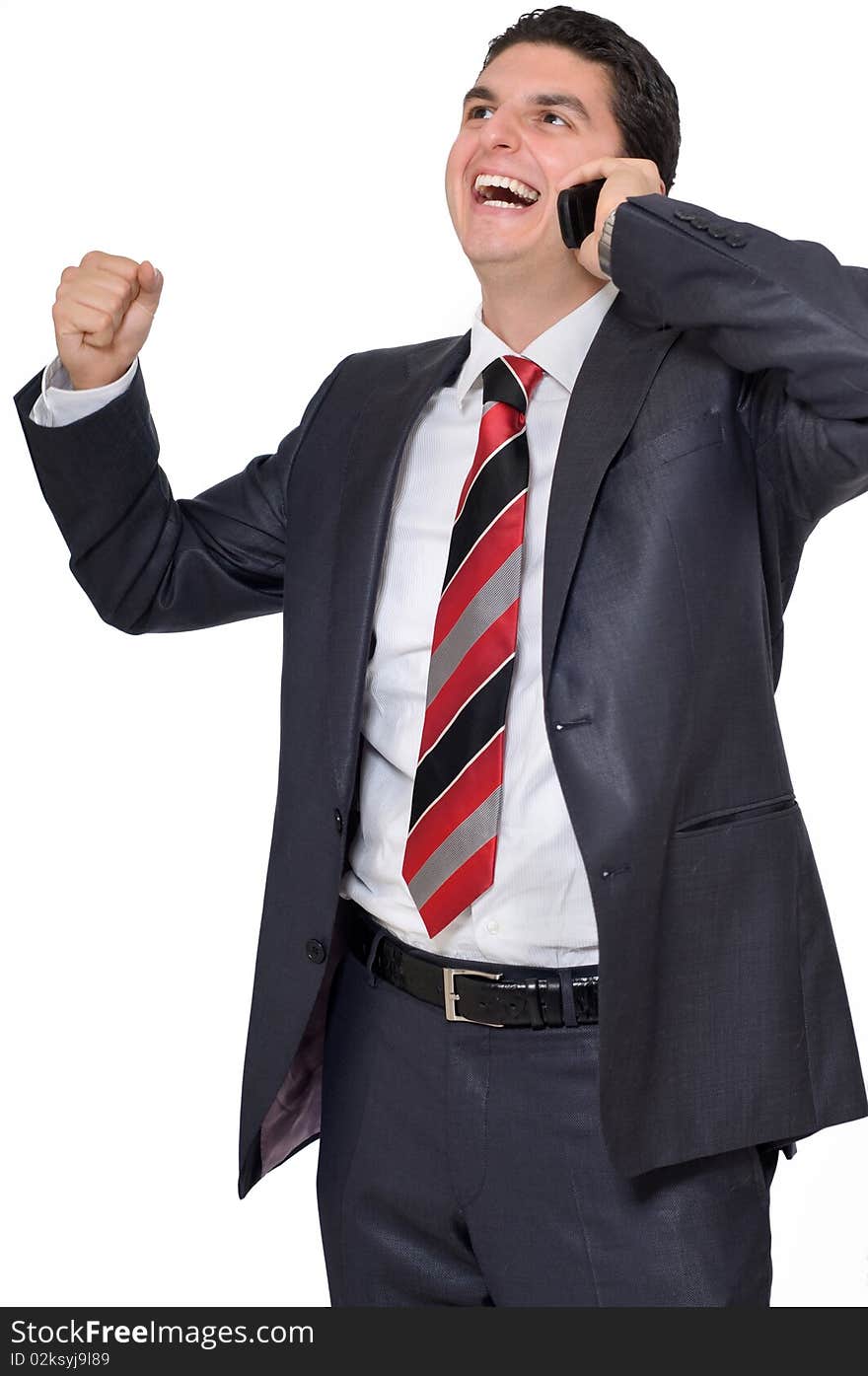 Businessman On Cell Excited And Laughing