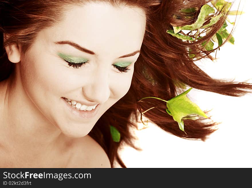 A beautiful young woman with flowers in her hair. A beautiful young woman with flowers in her hair.