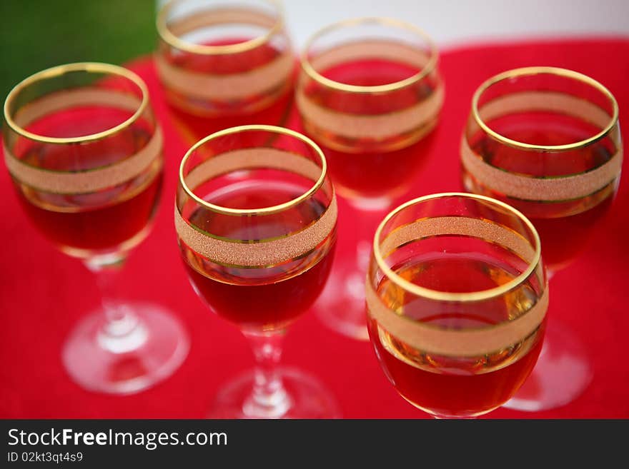 Wine glasses on a red table.