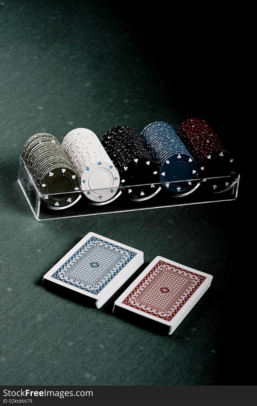 Casino gambling chips on green table. Casino gambling chips on green table