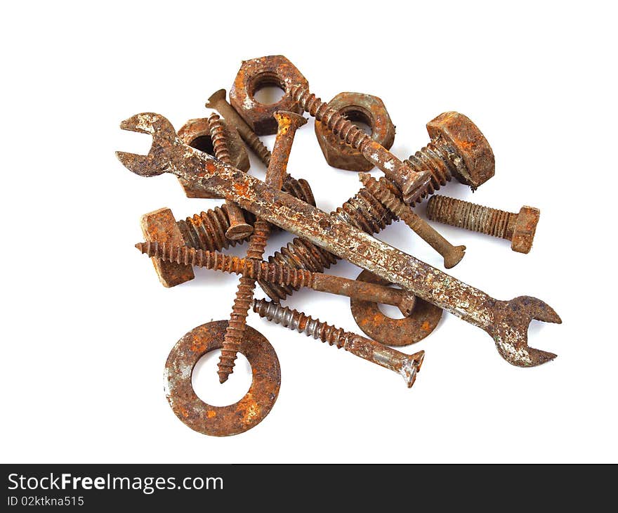 Rusty nuts, bolts, screws and spanner on a plane white background. Rusty nuts, bolts, screws and spanner on a plane white background.