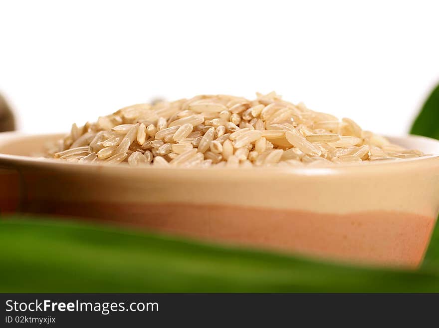 Brown rice in isolated white