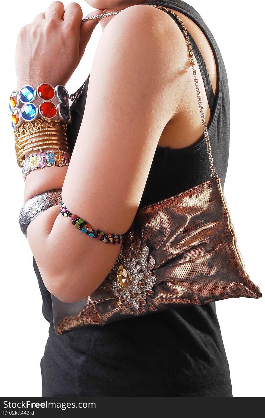 Girl with jewelery and purse isolated on a white background.