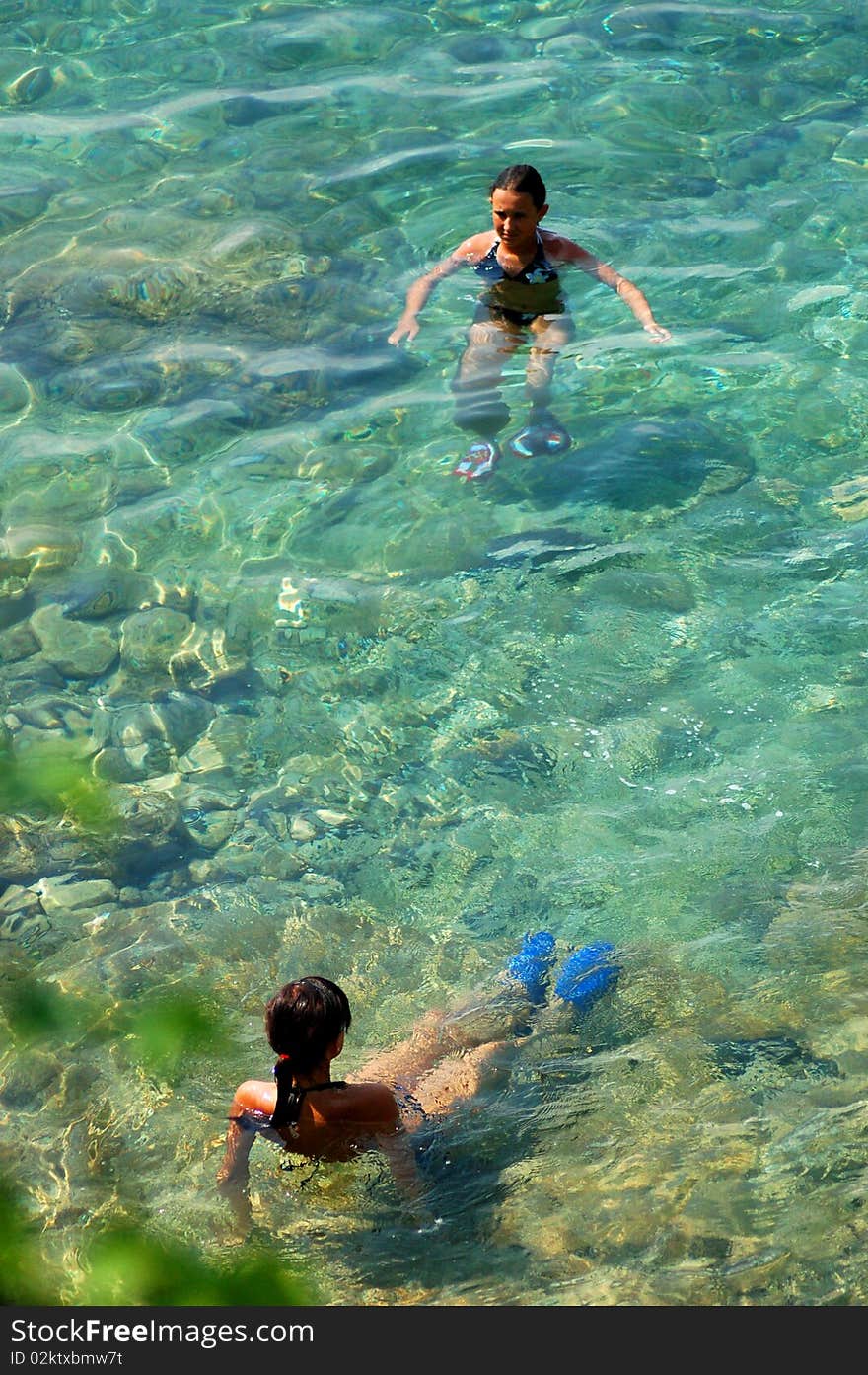 Two girls are having fun in adriatic water