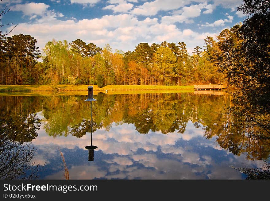 Late afternoon sky reflected in lake. Late afternoon sky reflected in lake