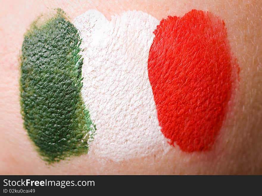 Italian flag painted on female cheek