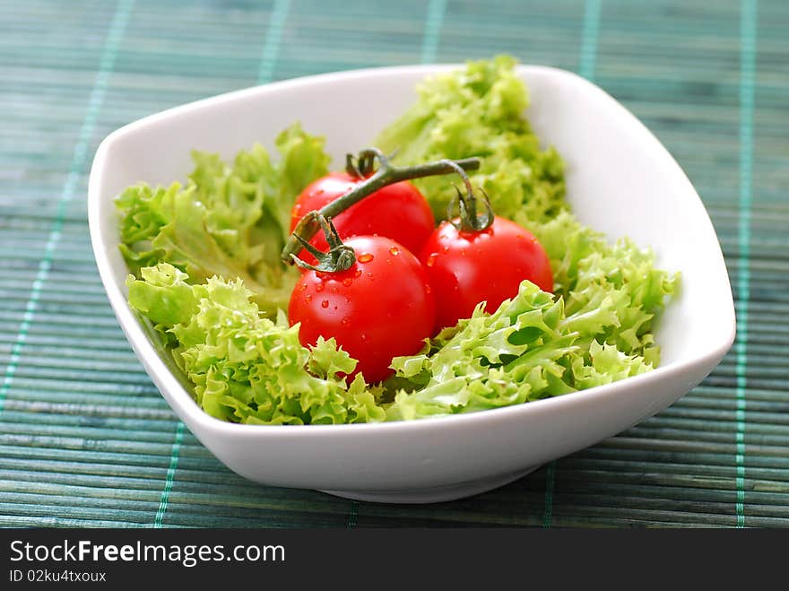 Fresh healthy tomatoes with lettuce hi-res